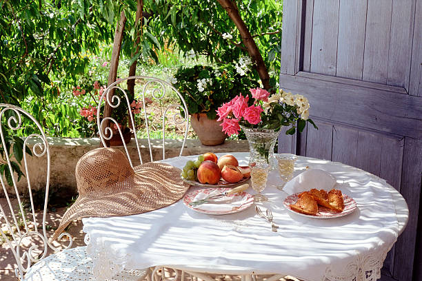 eating in the garden under a peach tree - garden decoration stock pictures, royalty-free photos & images