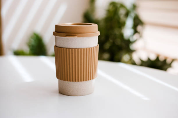 eco-friendly cup for hot drinks on white table with space for text - junk food stock pictures, royalty-free photos & images