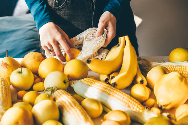 eco friendly shopping mesh bag with fruit. - food stock pictures, royalty-free photos & images