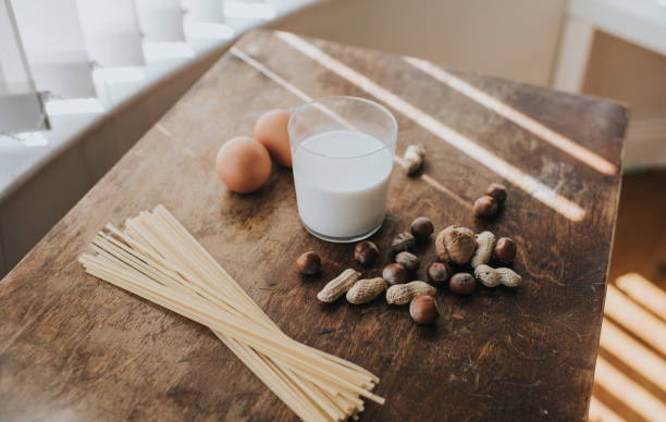 eggs, pasta, nuts and milk - food stock pictures, royalty-free photos & images
