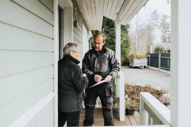 electrician and customer signing invoice - home decoration stock pictures, royalty-free photos & images