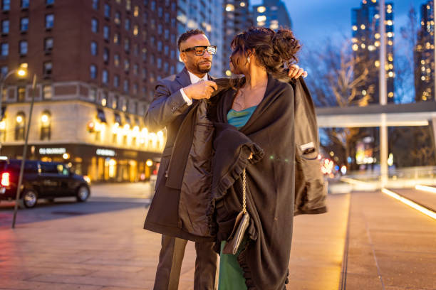 elegant couple heading to evening opera in manhattan, nyc - concert stock pictures, royalty-free photos & images
