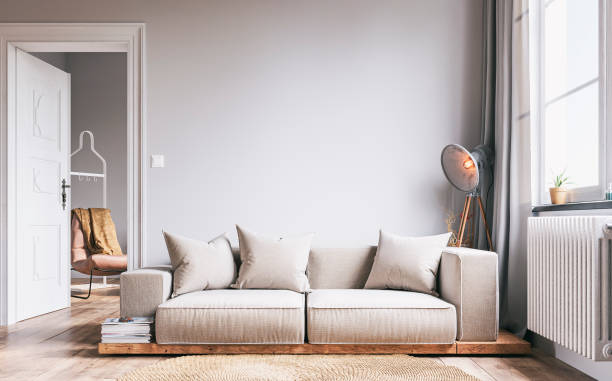 elegant living room with beige sofa and decoration and a peek of next room - fashion stock pictures, royalty-free photos & images