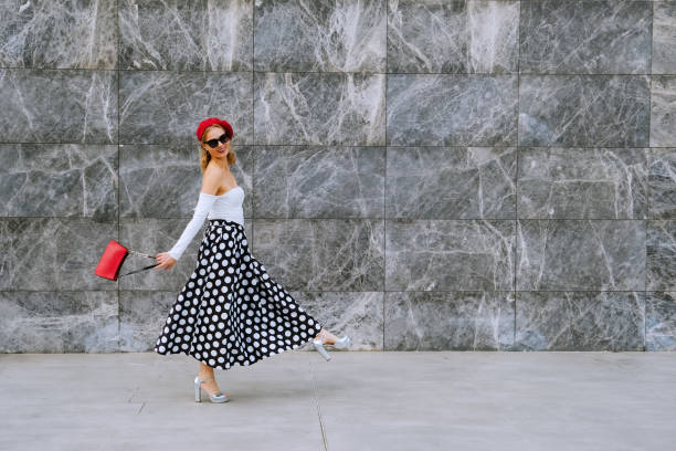 elegant woman walking. - fashion stock pictures, royalty-free photos & images