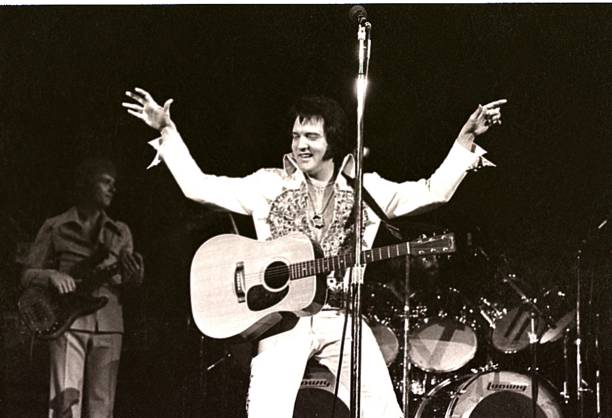 Elvis Presley performs in concert at the Milwaukee Arena on April 27, l977 in Milwaukee, Wisconsin.