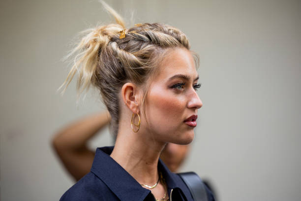 Emili Sindlev wears earrings outside Fendi during the Milan Fashion Week - Womenswear Spring/Summer 2024 on September 20, 2023 in Milan, Italy.