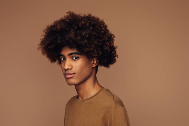 emotional african american man with african hairstyle - hairstyle stock pictures, royalty-free photos & images