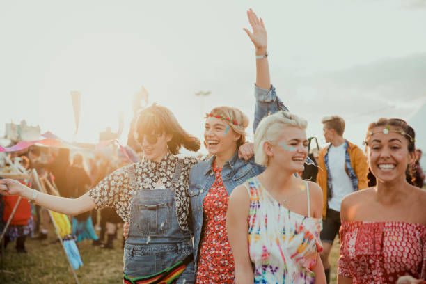 enjoying a music festival - concert stock pictures, royalty-free photos & images