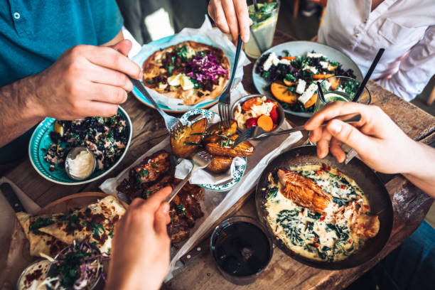 enjoying lunch with friends - food stock pictures, royalty-free photos & images