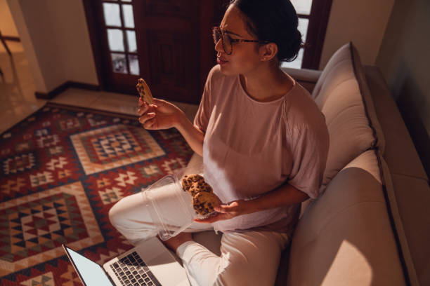 enjoying small treats. pregnancy moments . - junk food stock pictures, royalty-free photos & images