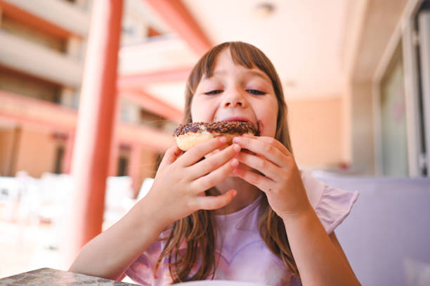 enjoying tasty food. - junk food stock pictures, royalty-free photos & images