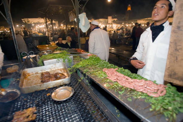 Evening barbecue food stall Place Djemaa El Fna Marrakech Morocco.
