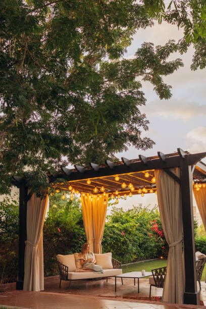 evening under the pergola - garden decoration stock pictures, royalty-free photos & images
