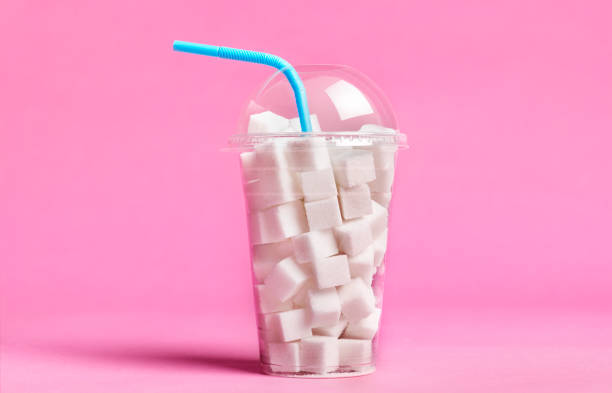 excess sugar in soda/fizzy drinks - food stock pictures, royalty-free photos & images