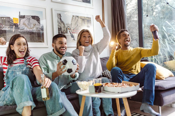 excited sports fans cheering for sport team - junk food stock pictures, royalty-free photos & images