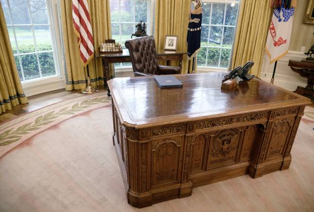 Executive Orders regarding trade lay on the Resolute desk in the Oval Office of the White House March 31, 2017 in Washington, DC. President Trump...