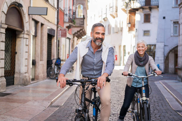 exploring city with bicycle - travel stock pictures, royalty-free photos & images