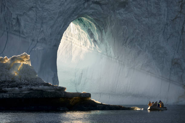 exploring icebergs, scoresbysund, greenland - travel stock-fotos und bilder