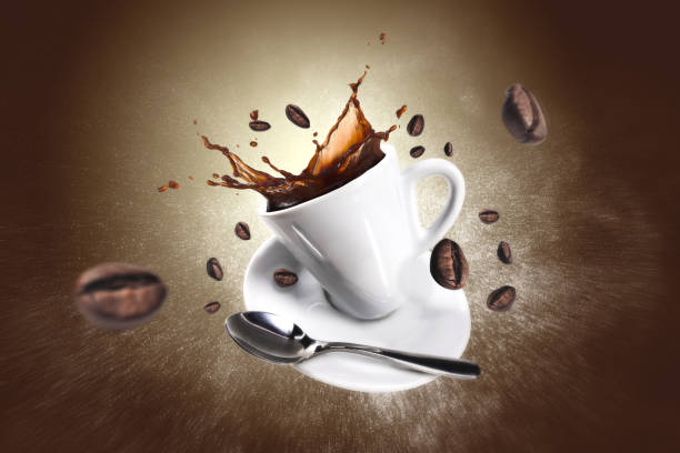 explosion of coffee with a cup and beans - coffee stock pictures, royalty-free photos & images