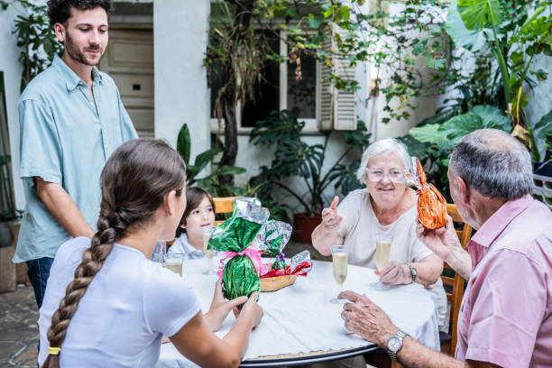 family celebrating easter at home - garden decoration stock pictures, royalty-free photos & images