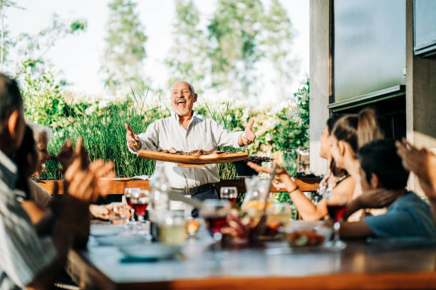 family enjoying weekend party - food stock pictures, royalty-free photos & images