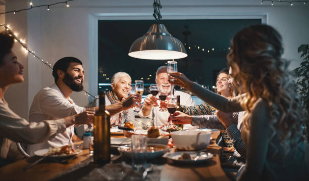family having dinner on christmas eve. - food stock pictures, royalty-free photos & images