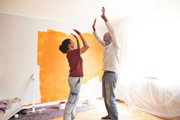 family having fun during home renovation - home decoration stock pictures, royalty-free photos & images