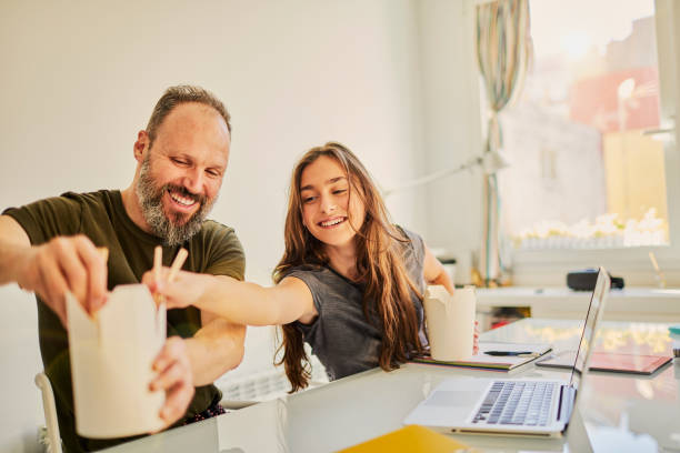 family moments, single father and daughter. - junk food stock pictures, royalty-free photos & images