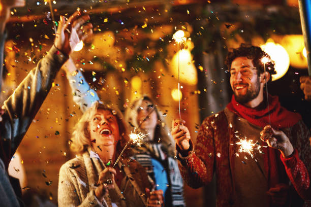 family new year's eve party. - garden decoration stock pictures, royalty-free photos & images