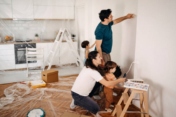 family whitewashes their apartment - home decoration stock pictures, royalty-free photos & images