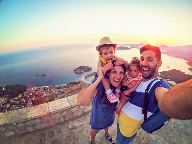 family with two little daughters travel in nature, making selfie, smiling - travel stock pictures, royalty-free photos & images
