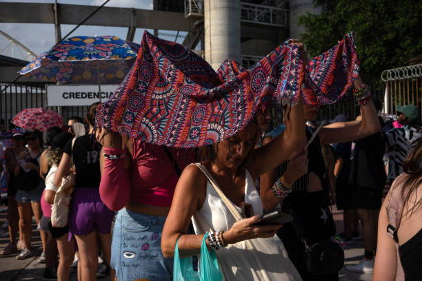 Fans of US singer Taylor Swift queue outside the Nilton Santos Olympic Stadium before Swift's concert, "Taylor Swift: The Eras Tour", amid a heat...
