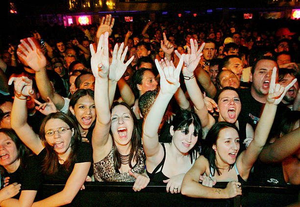 Fans react as Papa Roach performs at The Joint inside the Hard Rock Hotel & Casino August 5, 2005 in Las Vegas, Nevada. The rock group is touring in...