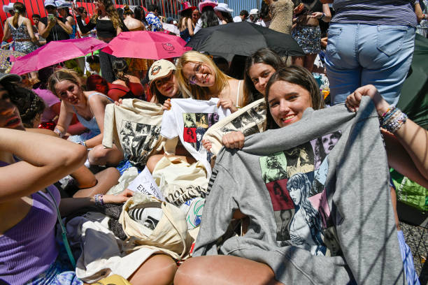Fans show Taylor Swift t-shirts as they camp waiting outside the premises where hundreds of people are already queuing to get into Lisbon's Estádio...