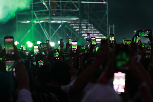 Fans take video with their smartphone during the FerxxoCalipsis Tour at Estadio Civitas Metropolitano on July 27, 2024 in Madrid, Spain.