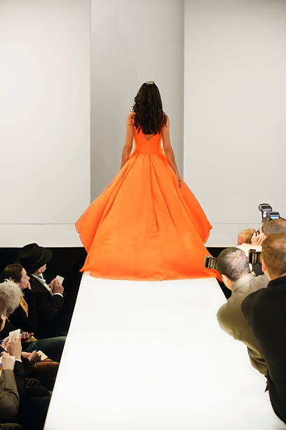 fashion model leaving runway - fashion photos et images de collection
