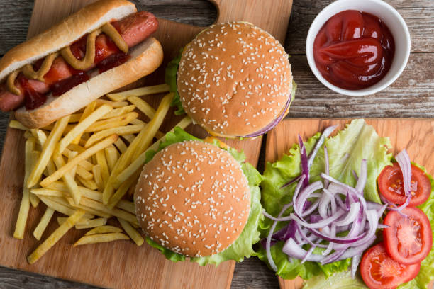 fast food on the wood - junk food stock pictures, royalty-free photos & images