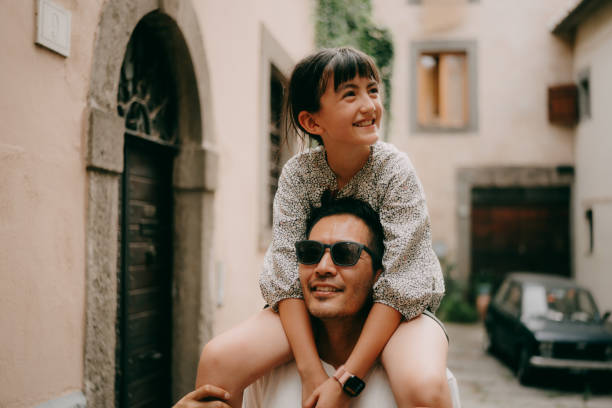 father and young daughter having fun in viterbo, italy - travel stock pictures, royalty-free photos & images