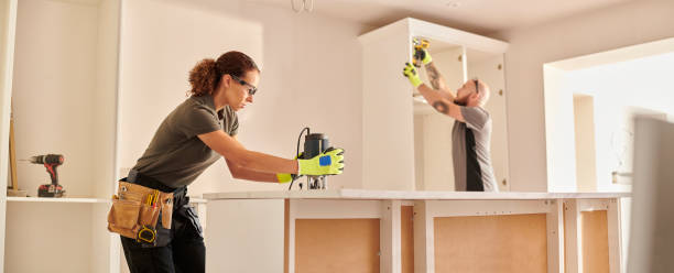 female carpenter routing kitchen counter - home decoration stock pictures, royalty-free photos & images