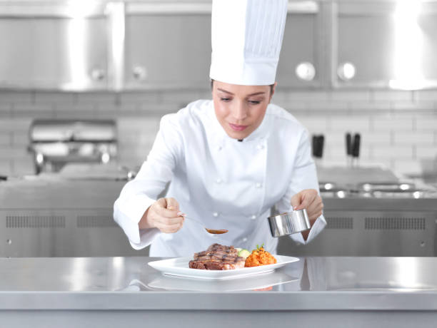 female chef preparing steak plate - food stock pictures, royalty-free photos & images