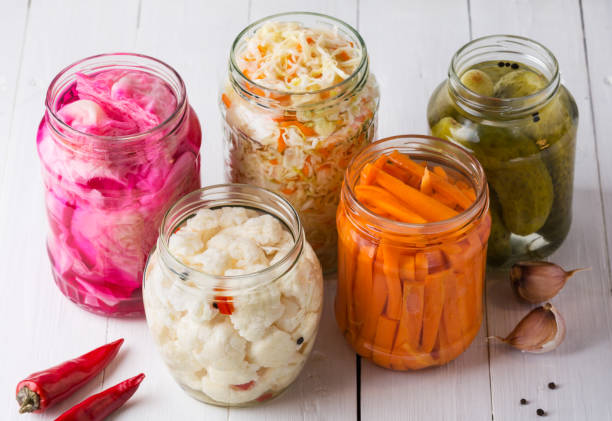 fermented vegetables. sauerkraut with carrots and cucumbers. - food stock pictures, royalty-free photos & images