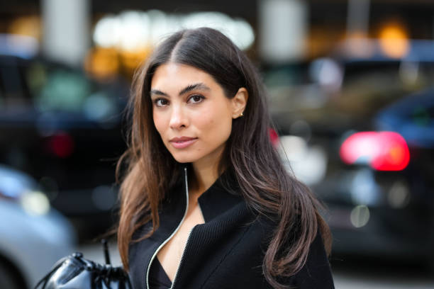 Fernanda Millan wears black oversized half unzipped sweater, outside Calvin Klein, during the New York Fashion week Fall/Winter 2025 on February 7,...