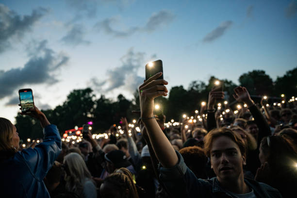 Festival goers light up the torchlights of their phones while Offset performs during Ruisrock 2024 on July 5, 2024 in Turku, Finland.