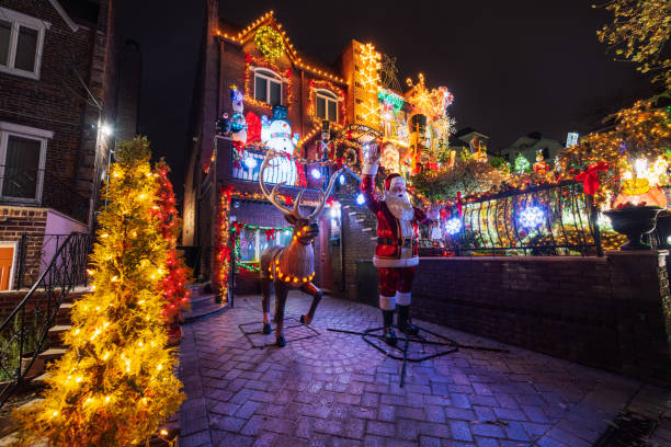 festive christmas decorated houses illuminated at night in brooklyn, new york - garden decoration stock pictures, royalty-free photos & images