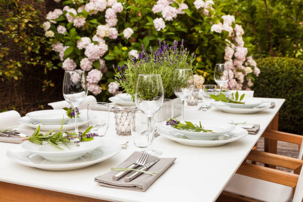 festive laid table in the garden - garden decoration stock pictures, royalty-free photos & images