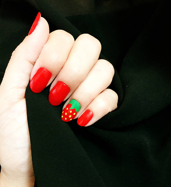 fingernails with strawberry nail art - nails art stock pictures, royalty-free photos & images