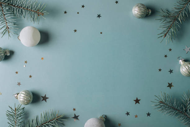 fir tree branches and festive decoration on blue background with empty space in the middle for text,kazakhstan - home decoration stockfoto's en -beelden
