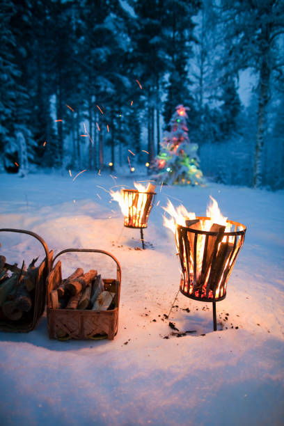 fires in pits in snowy field - garden decoration stock pictures, royalty-free photos & images