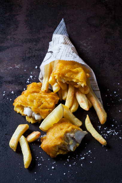 fish and chips with remoulade, ketchup and lemon slice - junk food stock pictures, royalty-free photos & images