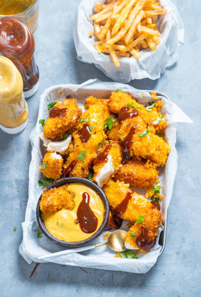 fish nuggets - junk food stock pictures, royalty-free photos & images